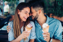 Happy Couple Having Date And Eating Ice Cream