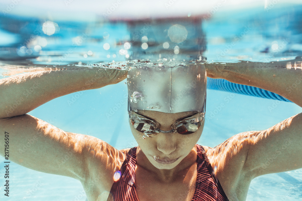 Woman swimmer inside swimming pool - obrazy, fototapety, plakaty 