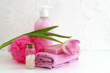 Liquid soap and two towels on a white background.