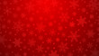 Christmas illustration with various small snowflakes on gradient background in red colors