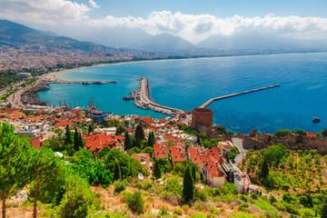 Wall Mural - Landscape with marina and Kizil Kule tower in Alanya peninsula, Antalya district, Turkey, Asia. Famous tourist destination with high mountains. Part of ancient old Castle. Summer bright day