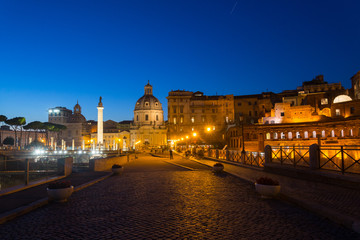 Wall Mural - Night scenery on the street at Roman square surrounded with Trajan Forum, Trajan's Market, Foro di Cesare - Viaggio nei Fori and Le Domus Romane di Palazzo Valentini, in Roman, Italy. 