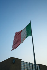 Firenze,Italy-July 26,2018: National flag of Italy flying in the early morning at Firenze Santa Maria Novella station, Florence, Italy