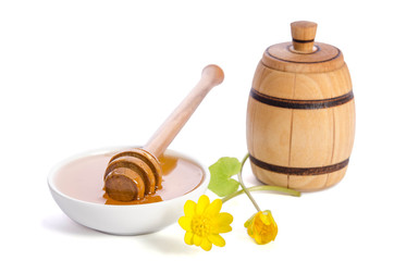 Wall Mural - honey in the glass bowl with dipper isolated on white background