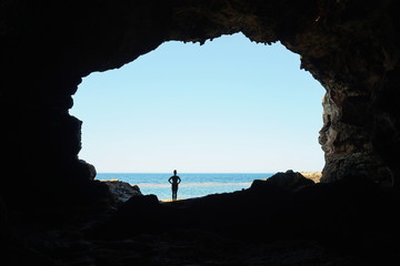 Opening to the sea from the inside of a large cave on the seashore, Cova Tallada, Mediterranean, Costa Blanca, Javea, Alicante, Valencia, Spain