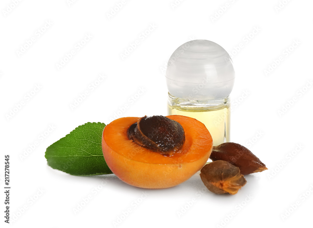 Bottle with apricot essential oil on white background