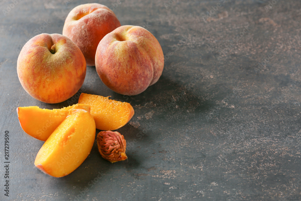 Fresh peaches on dark table