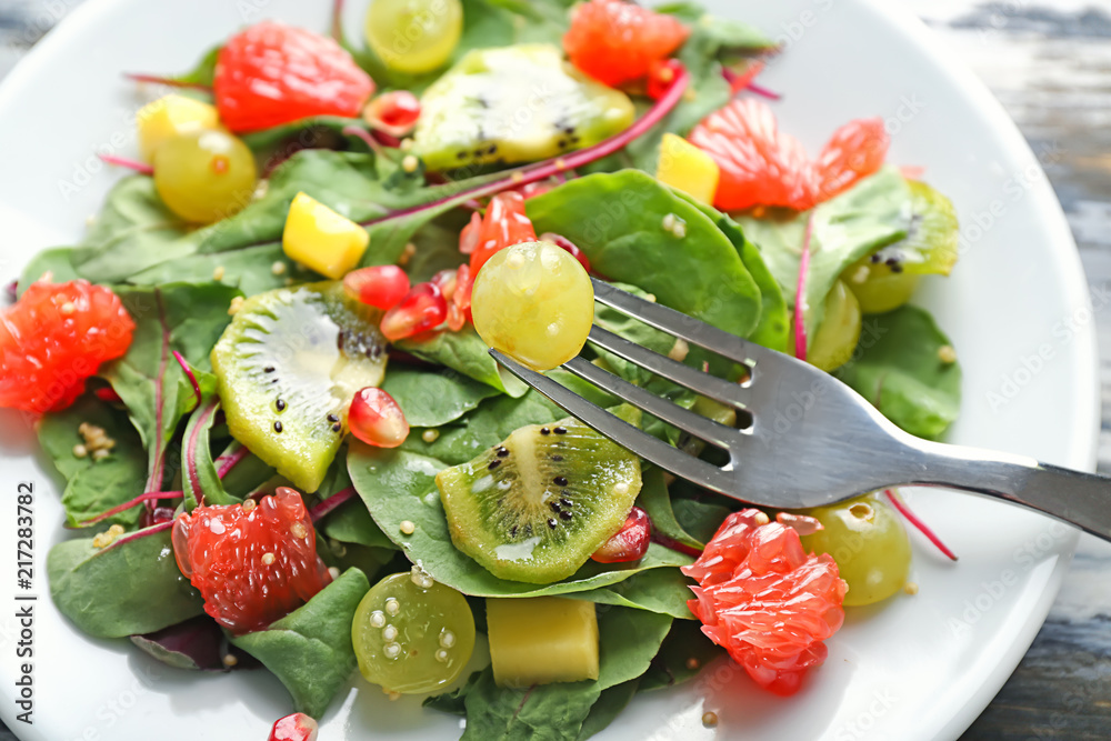 Healthy fresh salad on plate, closeup