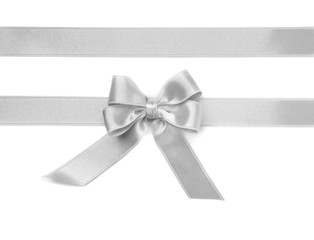 Silver ribbons with bow on white background