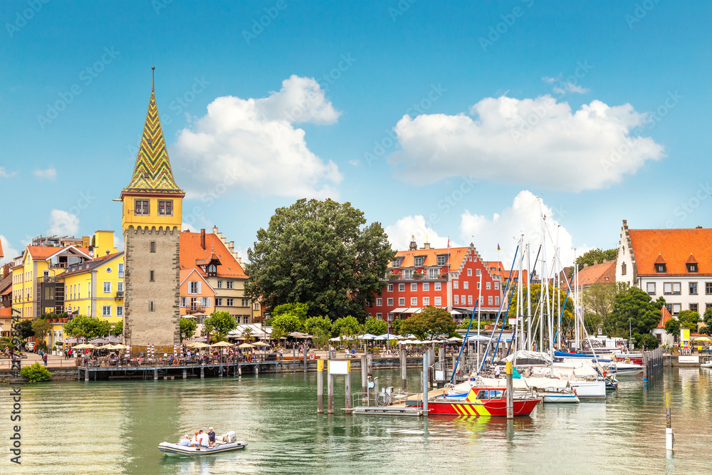 Harbor, promenade Seepromenade and the Mangturm tower in Lindau, a town on Lake Constance (or Bodensee) in Bavaria, Germany - obrazy, fototapety, plakaty 