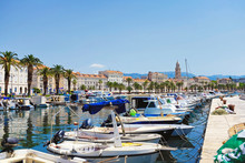 Split Old City With The Riva Palm Promenade And The Diocletian Palace From The Pier With Fisher Boats In The Foreground In Croatia