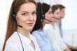 © rogerphoto - Call center. Beautiful cheerful smiling operator consulting clients with headset. Business concept of customer service