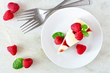 Poster - Slice of raspberry cheesecake, top view scene over a bright background
