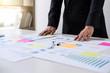 © Freedomz - Business Financing Accounting Banking Concept, business woman doing finances and calculate about cost to real estate investment and in other, tax system