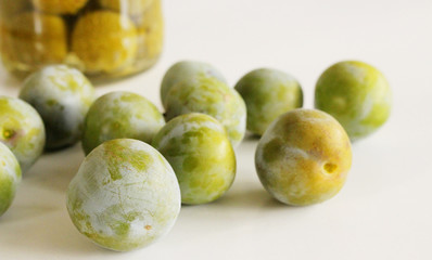 Sticker - A pile of greengage on a white background. Delicious fruit . Blurred background.Food and healthy concept.