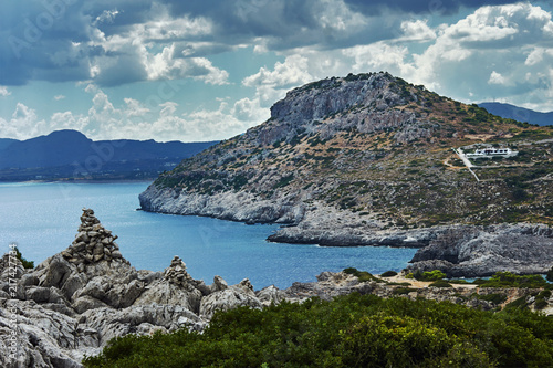 Fotografie, Obraz rocky cliff at the edge of the Mediterranean Sea, on the island of Rhodes