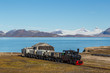 old industrial train in Ny Alesund, Spitzbergen, Svalbard, blue sky