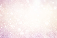 Pale Pink Glittering Christmas Lights. Blurred Abstract Background