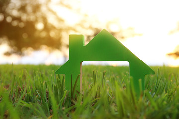 Image of vintage house in the grass, garden or park at sunset light.