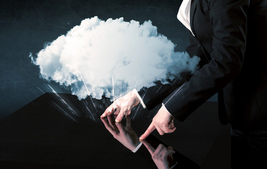 Poster - Male hands touching interactive table with a white cloud on it 