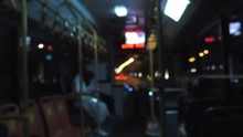 Blured Inside View Of Bus At Night. Traveling On Road By Bus In The Evening Hours