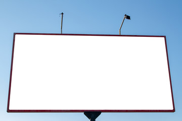 A magnificent billboard with two lanterns. White blank canvas in a bigboard mockup against the blue sky. A real white billboard for advertising. Blank display.