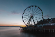 Ferris Wheel On Pier By The Sea In Seattle, USA