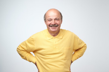 Poster - Portrait of mature european man looking at camera and smiling.