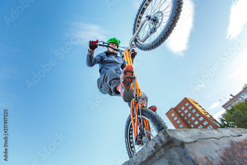 Fotografie, Obraz professional BMX rider made tricks on bicycle