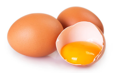 Raw eggs on white background