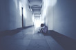© Creativa Images - Lonely schoolgirl crying in the school corridor