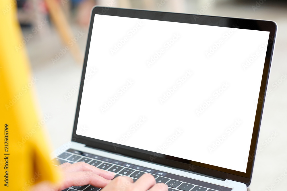 Woman hands using laptop computer with blank screen for mock up template background, business technology and lifestyle background concept