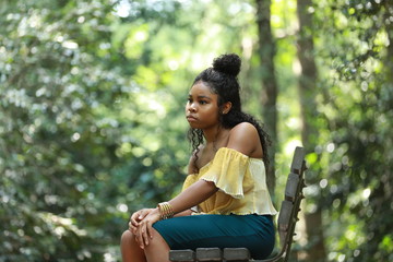 Wall Mural - Dull black woman on bench