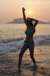© izzetugutmen - beautiful woman at the beach