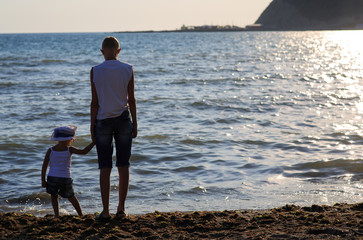 Wall Mural - Brother and sister on the seashore