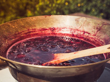 Old, Copper Pan, Wooden Spoon And Plum Jam. We Cook Outdoors. Preparations For The Winter