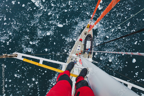 Fotografía sailing boat in Antarctica, extreme dangerous travel selfie, person feet standi