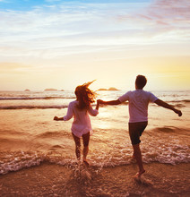 Happy Couple On Honeymoon Vacation Travel, Romantic Dream Beach Holidays, Happiness Background, Silhouettes Of Man And Woman Running To The Sea At Sunset Together