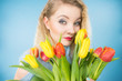 © Voyagerix - Pretty woman with red yellow tulips bunch