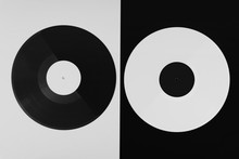 Top View Of A Black And A White Long Play Vinyl Record On The Black And White Background