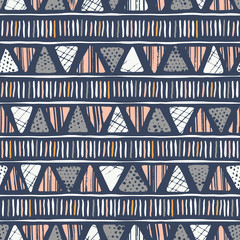 Wall Mural - Hand drawn tribal textured triangles and stripes on dark background vector seamless pattern. Ethnic geometric drawing