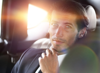 Wall Mural - successful man sitting in the car