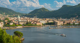 Fototapeta  - Panoramic view of Como city, overlooking the Lake Como, on a sunny summer afternoon. Italy.