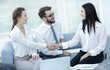 © ASDF - handshake of manager and client in the office lobby