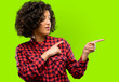 © Krakenimages.com - Beautiful arab woman pointing away side with finger