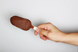 Hand Holding Chocolate Covered Popsicle ice cream