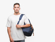 © Krakenimages.com - Handsome young man holding backpack with a confident expression on smart face thinking serious
