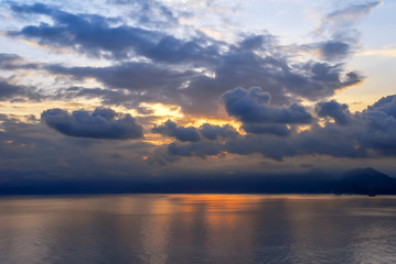 Poster - Antalya, Turkey, 20 December 2010: Gulf of Antalya with clouds and sunset