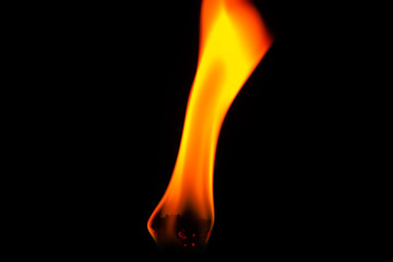 Wall Mural - Close up of flame from lighter isolated on black background