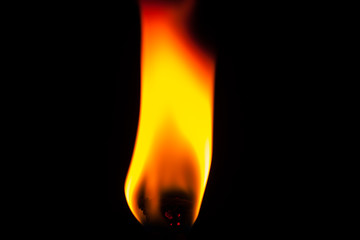 Wall Mural - Close up of flame from lighter isolated on black background